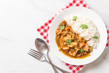 Japanese curry rice with sliced pork, carrot and onions