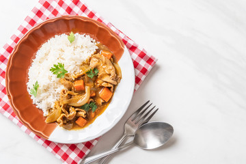 Japanese curry rice with sliced pork, carrot and onions