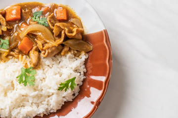 Japanese curry rice with sliced pork, carrot and onions