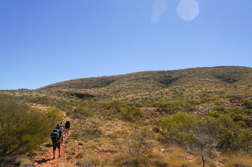 a group of Hikers on the way to the top of Mount Sonder just outside Alice Springs, West MacDonnel National Park, Australia