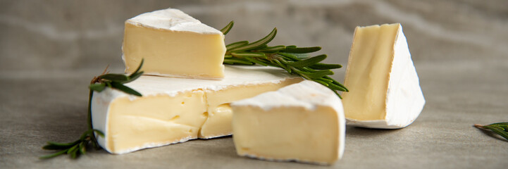 Cheese camembert or brie with fresh rosemary