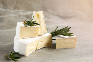 Cheese camembert or brie with fresh rosemary