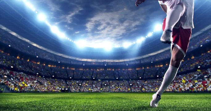 Soccer player succeed in making a strong penalty kick. The player is wearing unbranded soccer uniform. The stadium and crowd are made in 3D and animated.