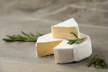 Cheese camembert or brie with fresh rosemary