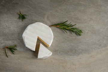 Cheese camembert or brie with fresh rosemary