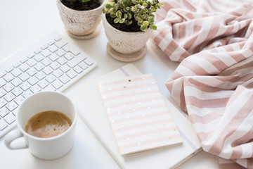 Minimalist ladys flat lay workplace decoration with coffee cup and keypad