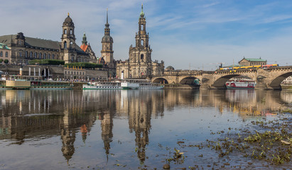 Fototapeta premium Dresden, Germany - the Elbe River cuts Dresden in two halves, and its one the main landmarks of the city, offering a large number of amazing views. Here in particular the Old Town and Augustus Bridge