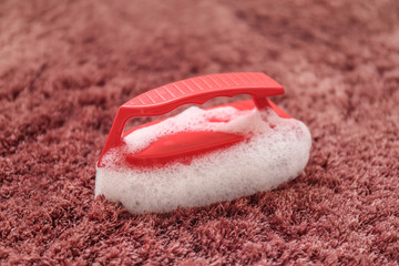 Brush with foam on soft carpet