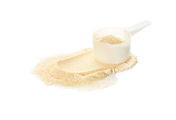 Scoop with protein powder on white background