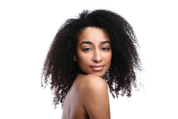 Young African-American woman on white background