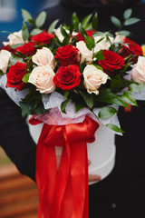 Colorful stylish wedding bouquet of flowers lies on the brown background. Bouquet of the bride.