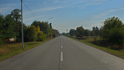 Empty countryside asphalt road, autumn landscape