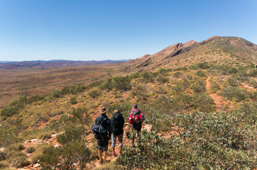 a group of Hikers on the way to the top of Mount Sonder just outside Alice Springs, West MacDonnel National Park, Australia
