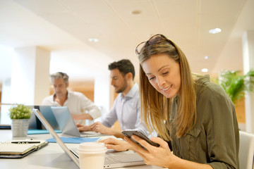 Female startup team member working in office