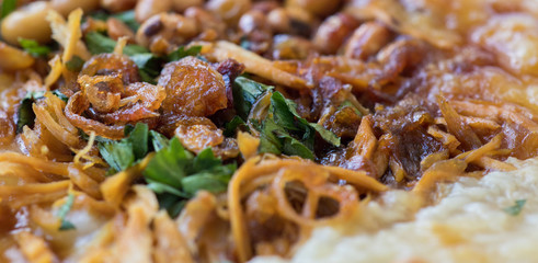 Bubur ayam is a porridge mixed with chicken meat served with egg and vegetables - Image