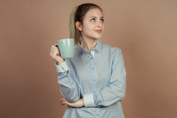 girl with a cup of tea and coffee