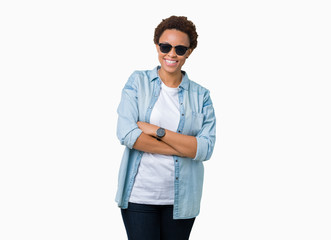 Beautiful young african american woman wearing sunglasses over isolated background happy face smiling with crossed arms looking at the camera. Positive person.