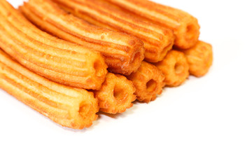 spanish fritters on white background