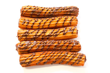 spanish chocolate fritters with white background