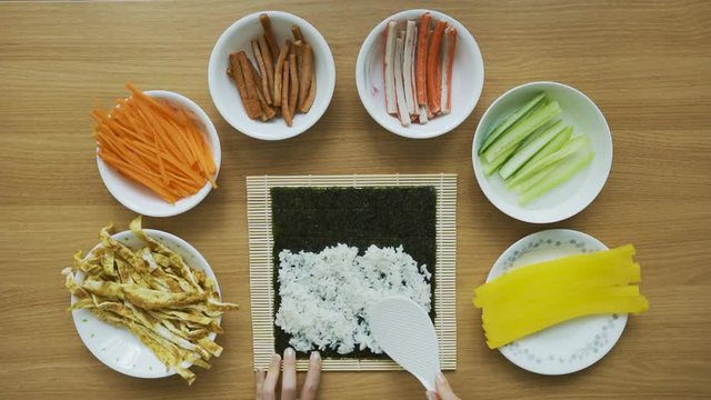 Preparing Korean Food and rolling Kimbap