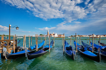 Gondolas and in lagoon of Venice by San Marco square. Venice, Italy