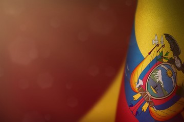 Ecuador flag for honour of veterans day or memorial day. Glory to the Ecuador heroes of war concept on red dark velvet background.