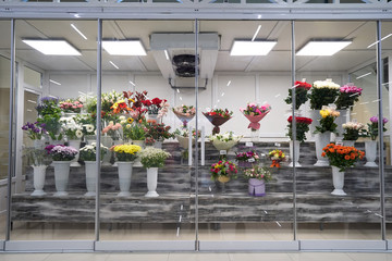 Flowers for sale in a special cold room with air conditioning. Refrigerator for flowers