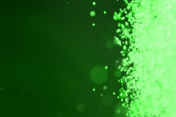 green glossy sparks one side frame bokeh texture - nice abstract photo background