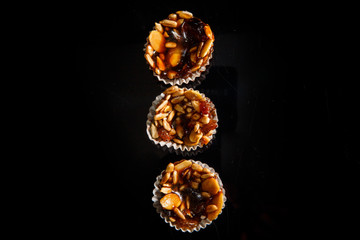 top view on three of useful handmade candies with sunflower and pumpkin seeds
