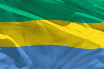 Waving Gabon flag for using as texture or background, the flag is fluttering on the wind
