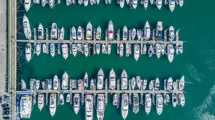 Fotobehang Yacht parking, A marina lot, Yacht and sailboat is moored at the quay, Aerial view by drone. © Kalyakan