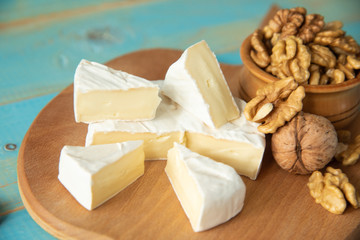 Cheese camembert or brie with walnut kernels