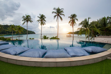 Infinity swimming pool modern luxury hotel, The hotel luxury swimming pool overlooks a wooden...