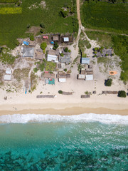 A view from above of the small huts on Tampah beach in Lombok, Indonesia