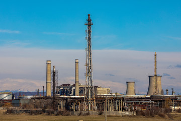 Fototapeta na wymiar Oil refinery with facilities, tanks and trains