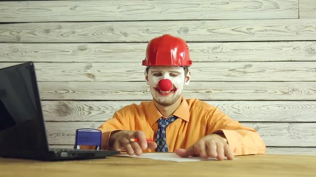 Clown businessman working in the office