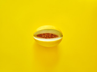 Yellow Melon Fruit isolated in yellow background viewed from above - flatlay look - Image