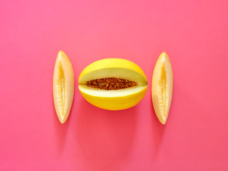 Yellow Melon Fruit isolated in fucsia background viewed from above - flatlay look - Image