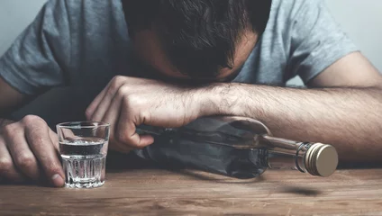 Fotobehang Caucasian alcoholic man with vodka. © andranik123