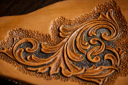 embossed pattern on the leather in the workshop