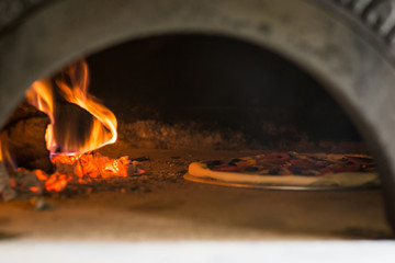 Italian pizza is cooked in the oven