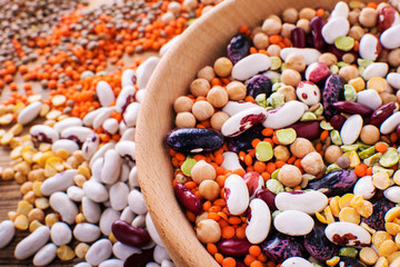 Raw legume on old rustic wooden table, close-up.