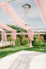 Table setting at a luxury wedding reception. Outdoor wedding