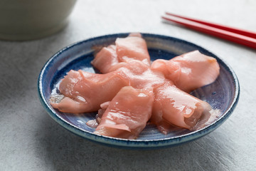 Pink pickled sushi ginger slices in bowl