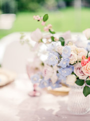 Obraz na płótnie Canvas Table setting at a luxury wedding reception. Outdoor wedding