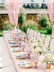 Table setting at a luxury wedding reception. Outdoor wedding