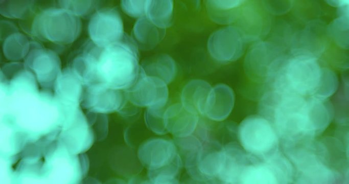 Defocused, blurred bokeh and abstract blurred light element for cover decoration or background. Royalty high-quality free stock video footage of colorful light, glowing backdrop overlay for design