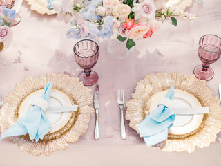 Table setting at a luxury wedding reception. Outdoor wedding