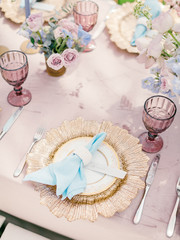 Table setting at a luxury wedding reception. Outdoor wedding