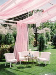 Table setting at a luxury wedding reception. Outdoor wedding